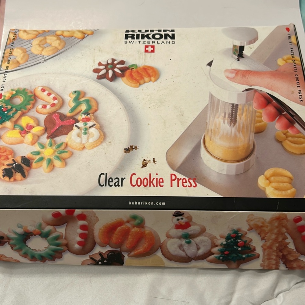 By Kuhn Rikon, clear barrel cookie press with accessories.
